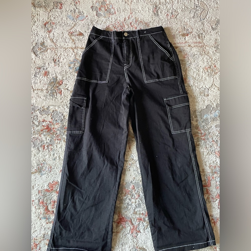 Black Cargo pants with white stitching.